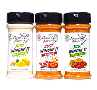Thumbnail for Three jars of Pawpa Flavor seasoning spices on a white background: Just Wingin' It Garlic Parmesan, Just Wingin' It Barbecue, and Just Wingin' It Street Wangz.