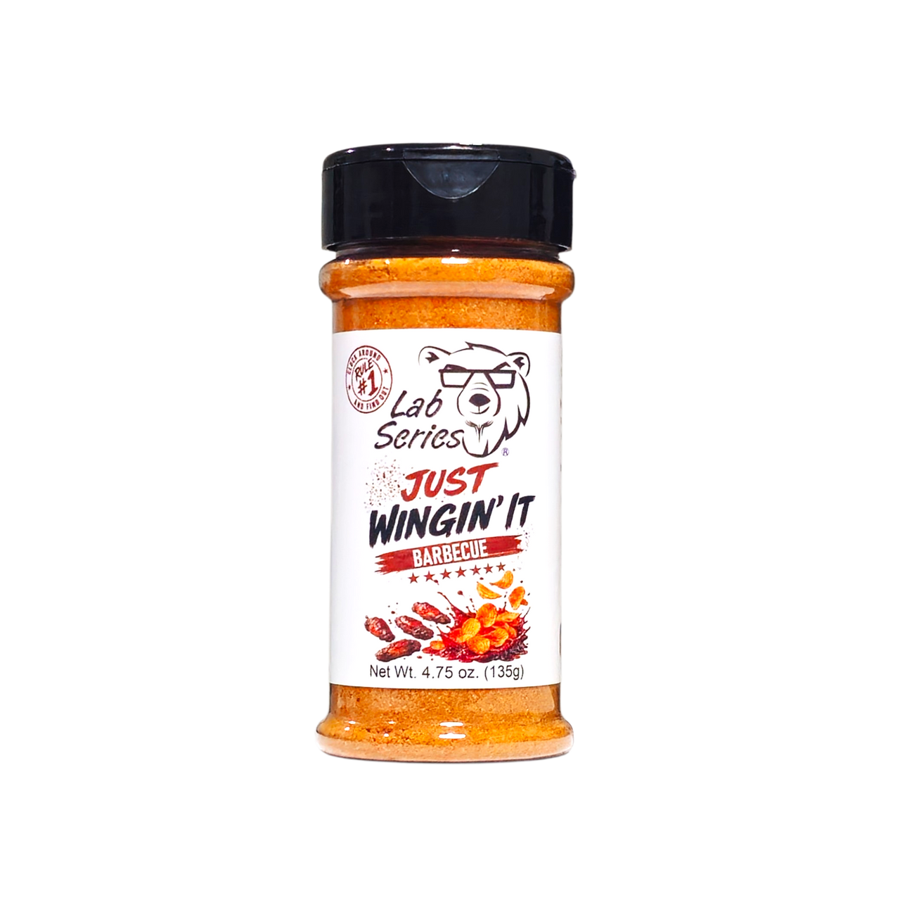 A bottle of Lab Series Just Wingin' It Barbecue spice blend, featuring orange-red seasoning inside a clear plastic bottle with a black shaker cap and a white label.